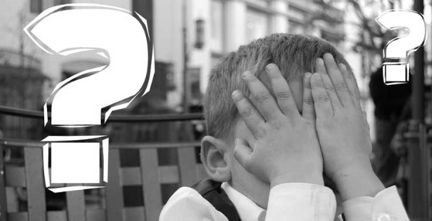 Little Boy with head in hands