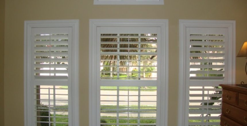 White Plantation shutters on a beige wall